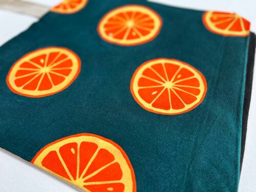 oranges on dark green background tote bag zoom in detail