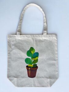 rose and succulent plant in a pot tote bag succulent