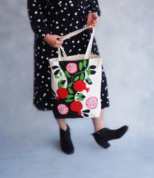 pomegranates black and white artsy tote bag in use