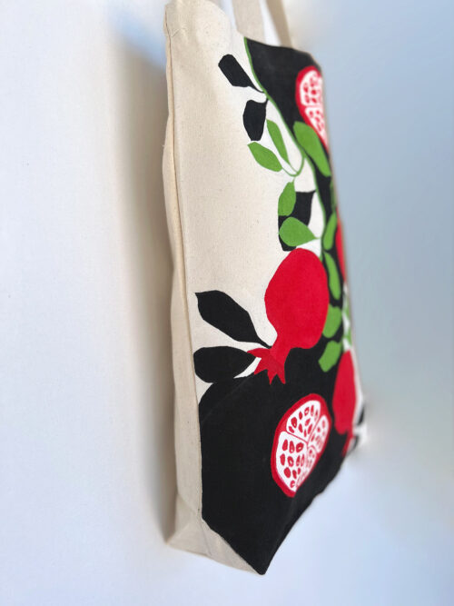 pomegranates black and white artsy tote bag side view