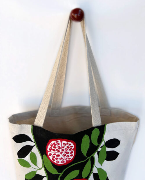pomegranates black and white artsy tote bag top view