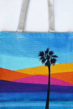 ocean sunset and palm tree tote bag