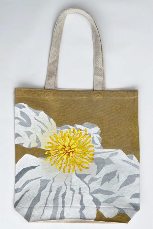 white poppy on golden background tote bag